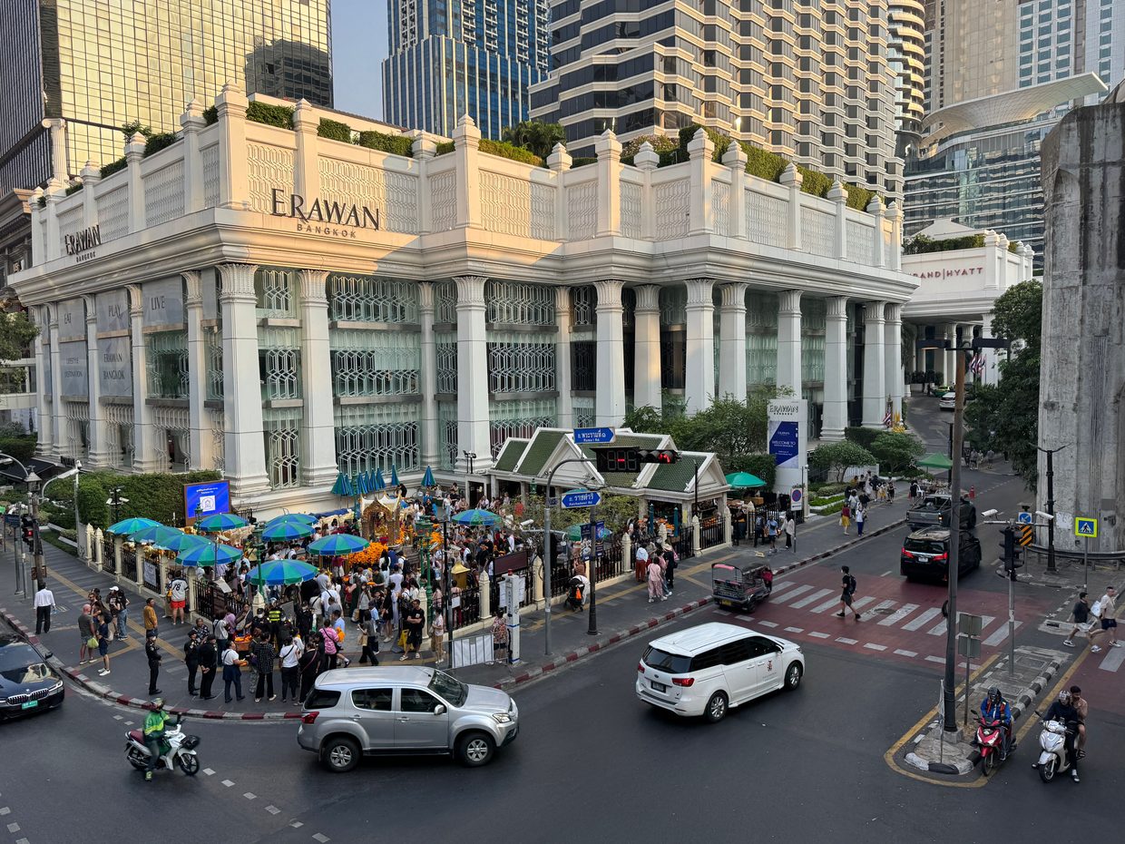 Crowds at the Erawan Shrine beside the Ratchaprasong intersection in central Bangkok